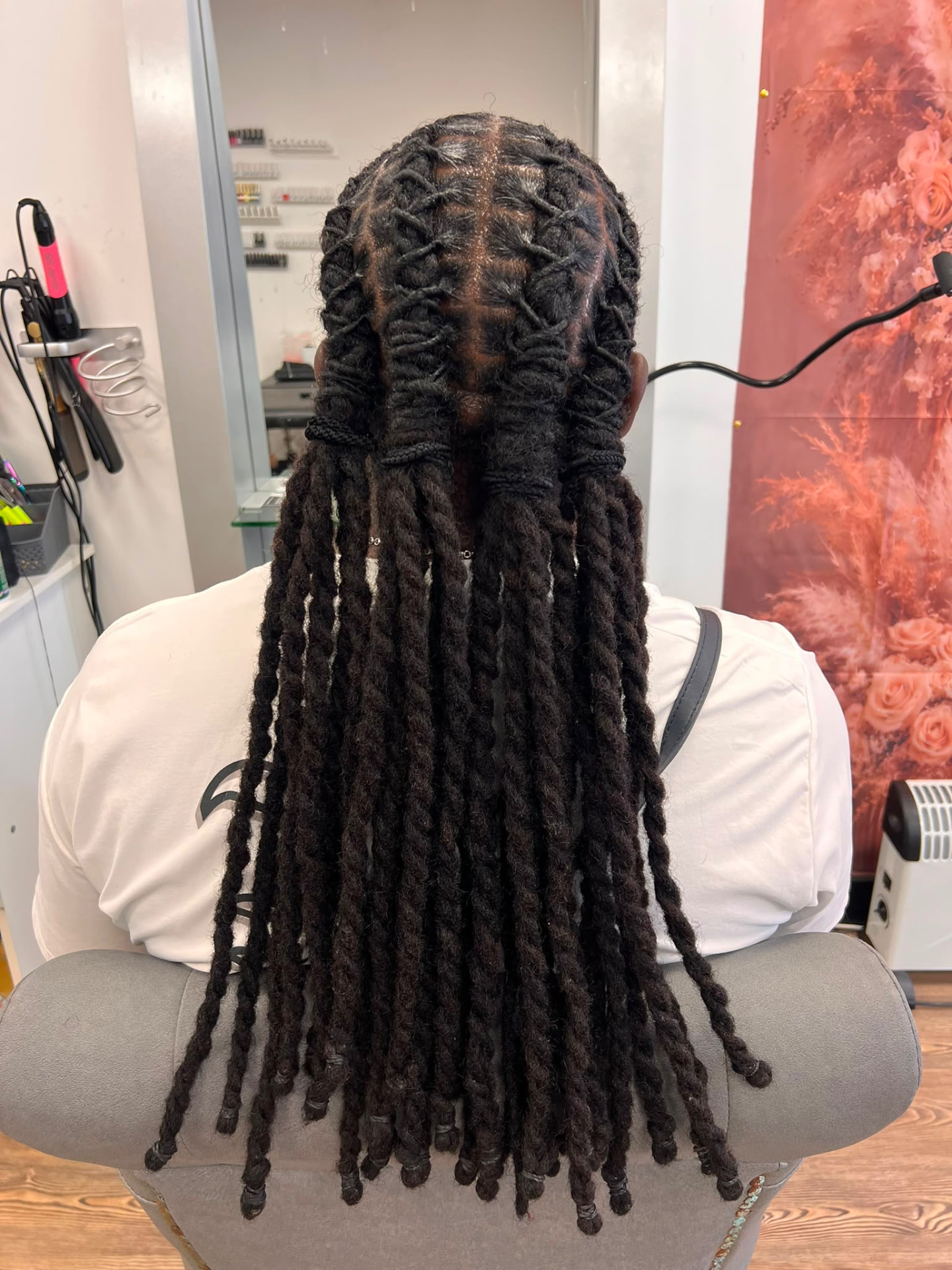 Long locs styled into barrel twists