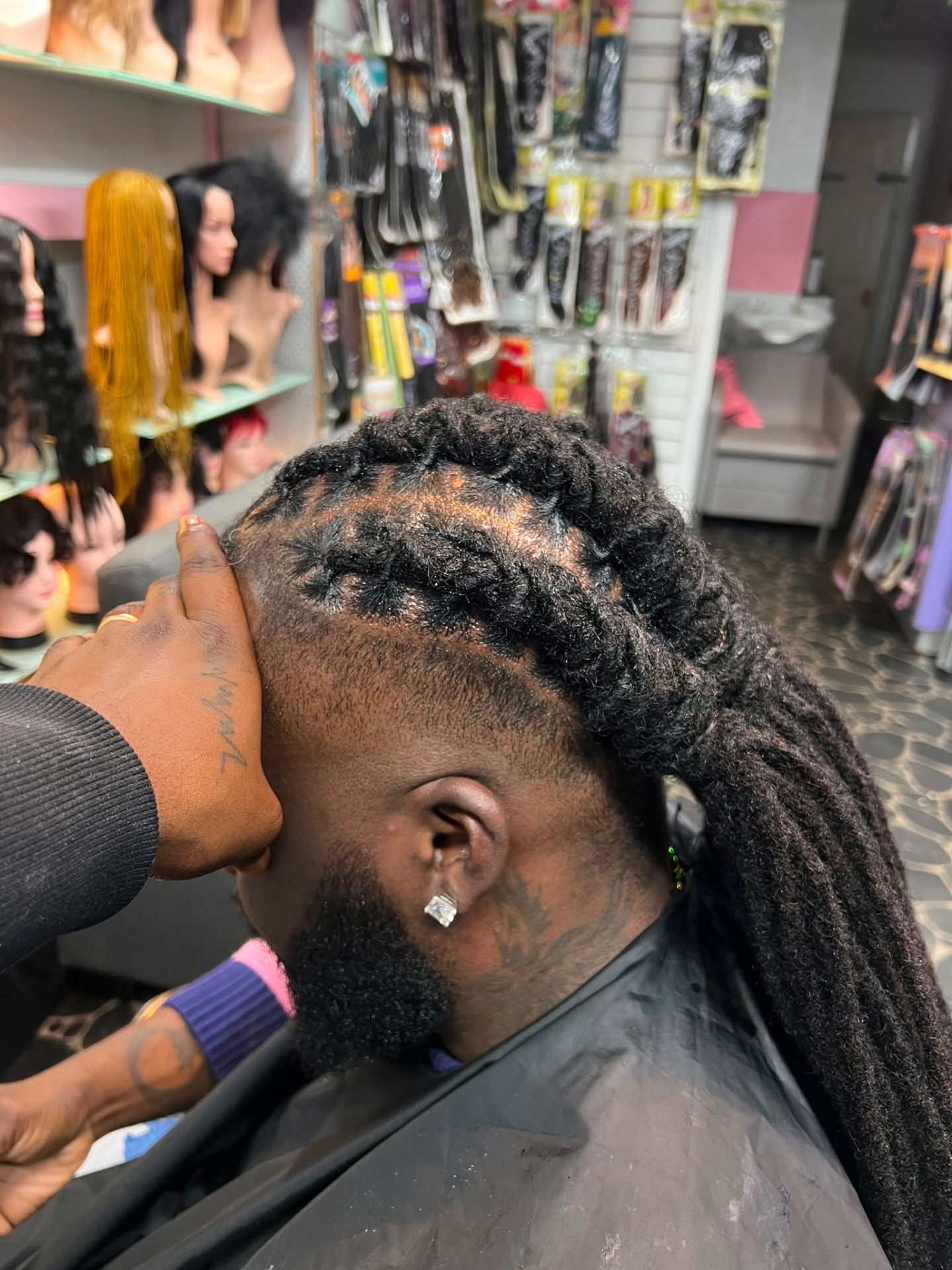 Long barrel-twist loc style on a male client