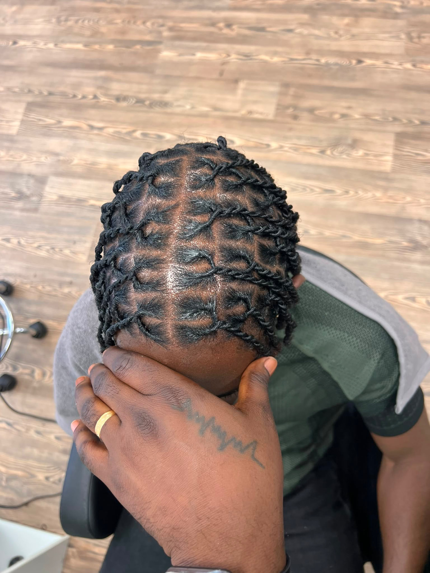 Short two-strand loc twists on a male client