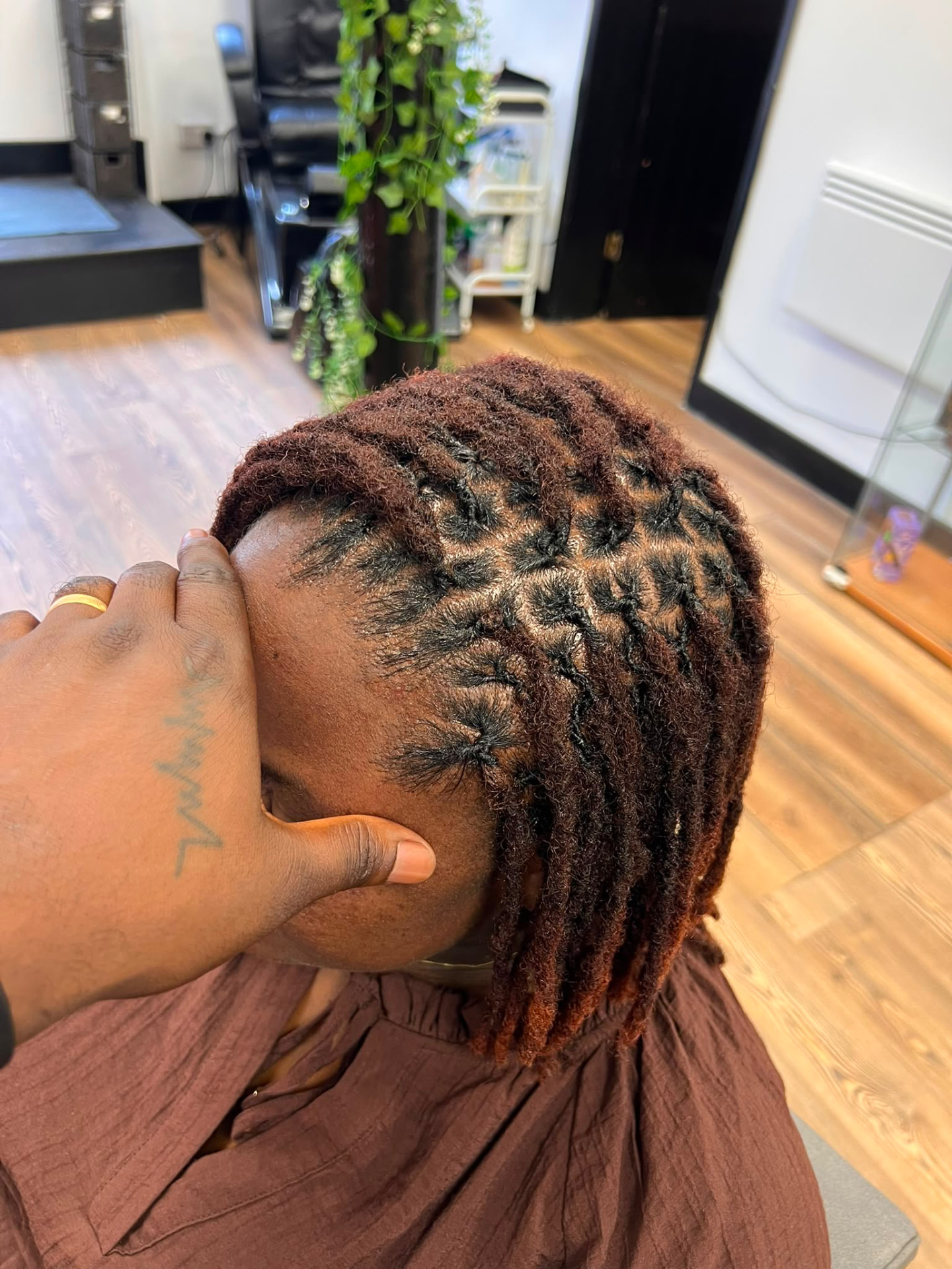 Auburn-tipped loc retwist and finish