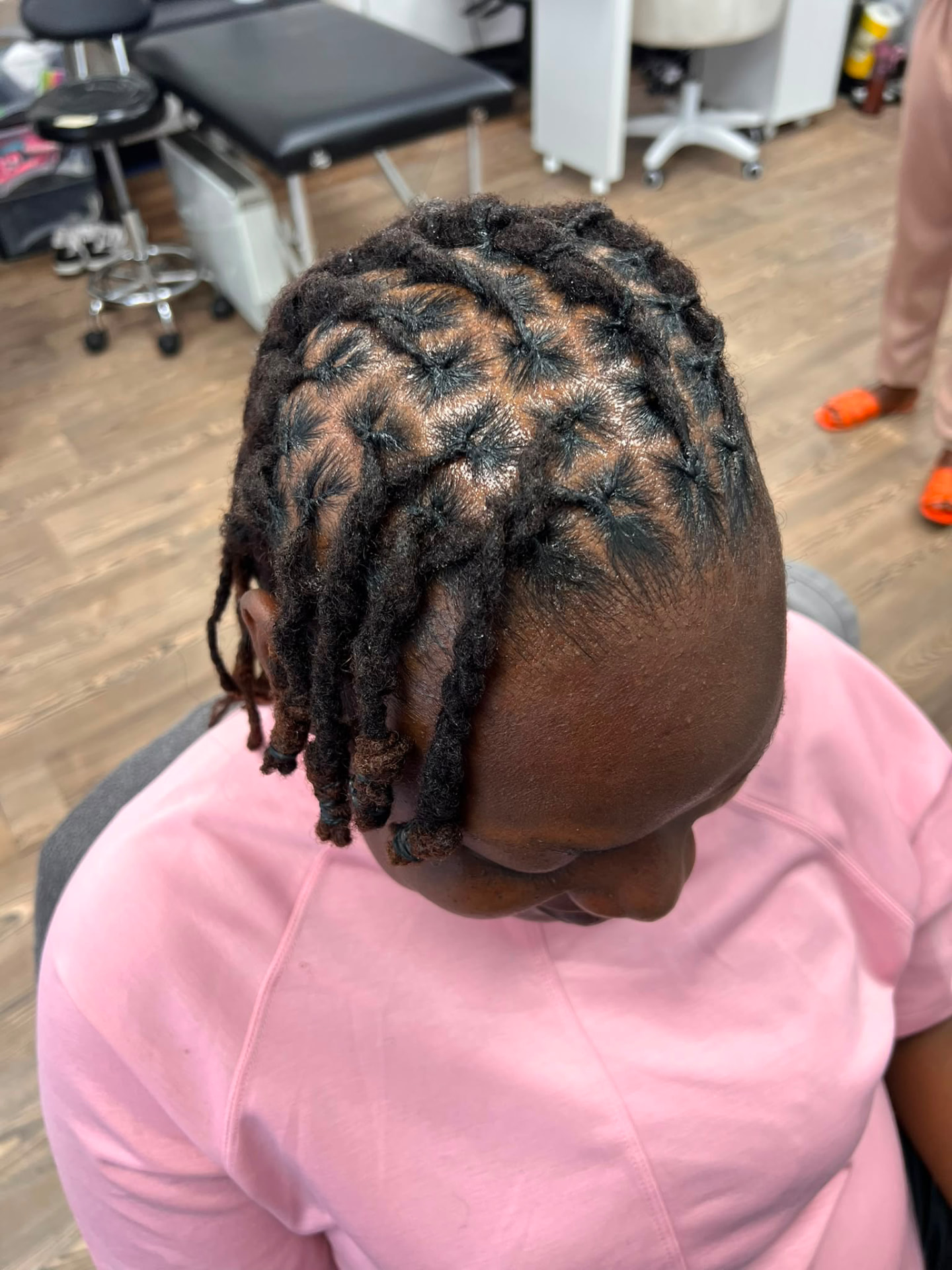 Fresh short loc retwist with detailed parting