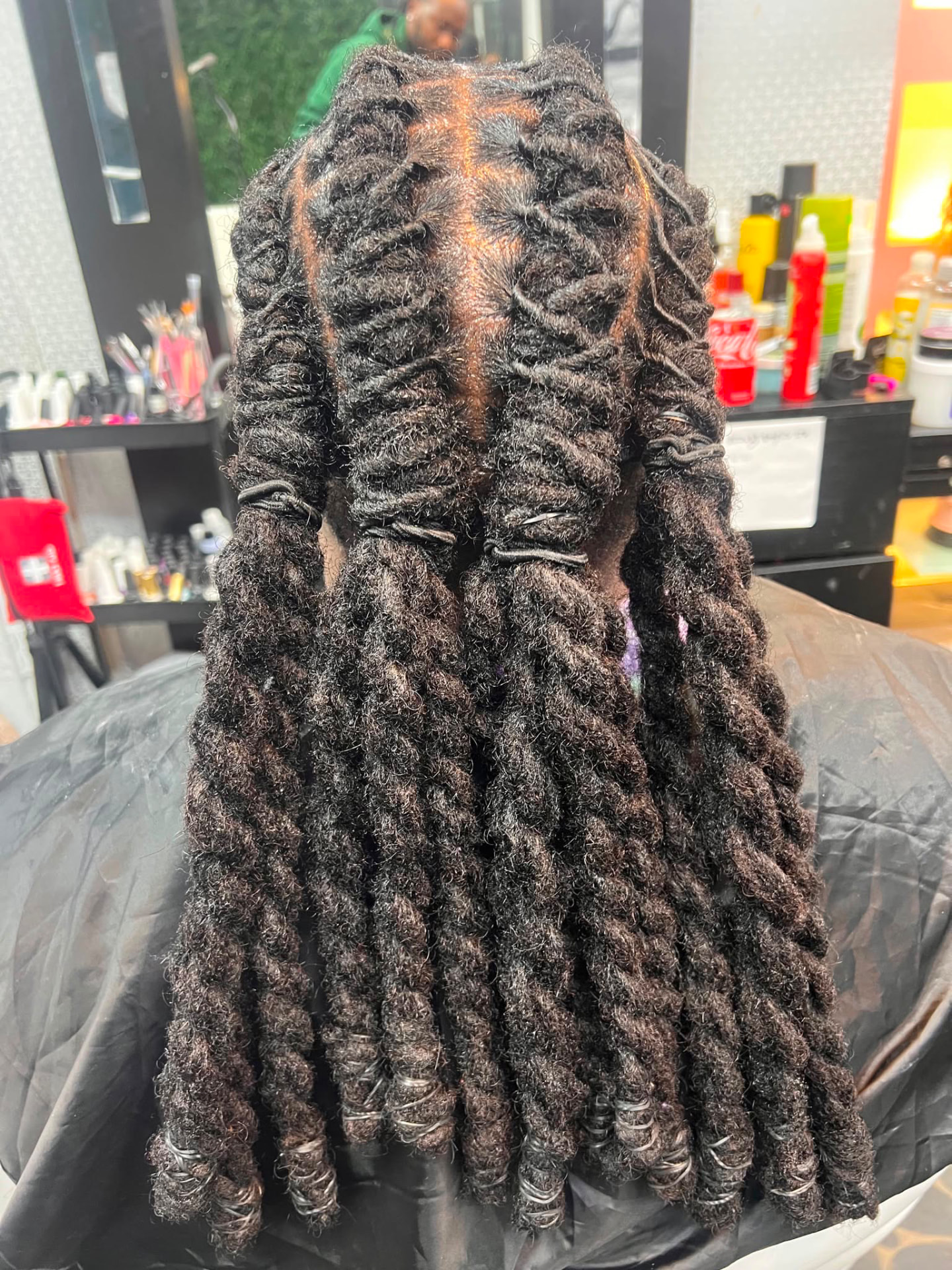 Back view of long barrel-twist loc styling