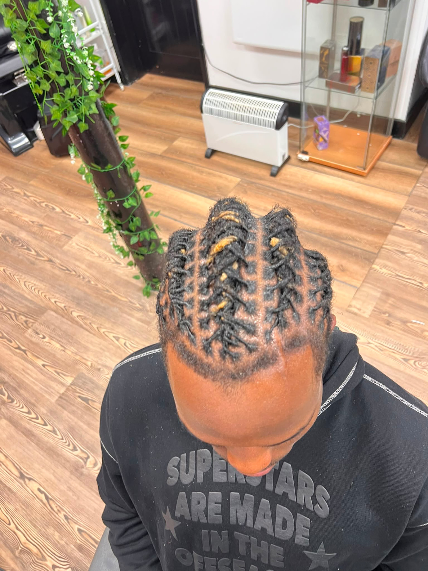 Sculpted barrel-twist loc style on a male client